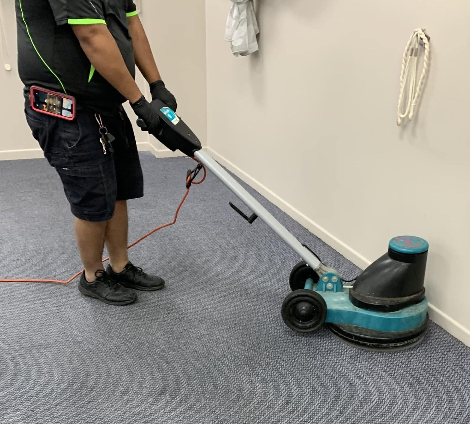 A employee is cleaning a commercial building